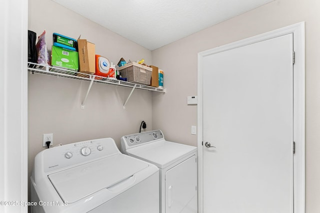 laundry room featuring laundry area and washing machine and clothes dryer