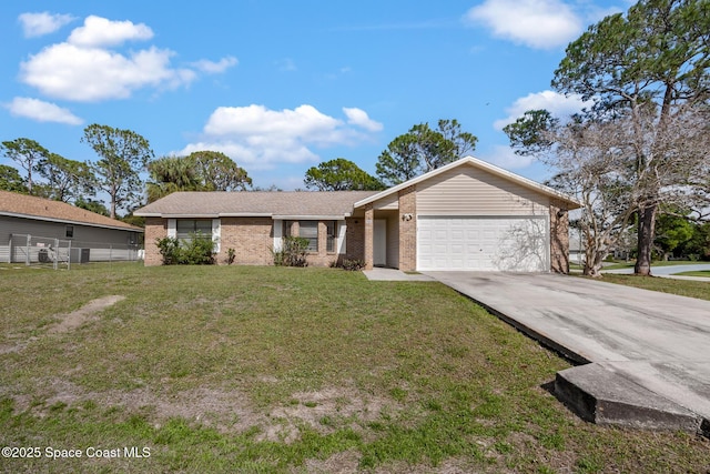 ranch-style house with driveway, brick siding, an attached garage, and a front yard