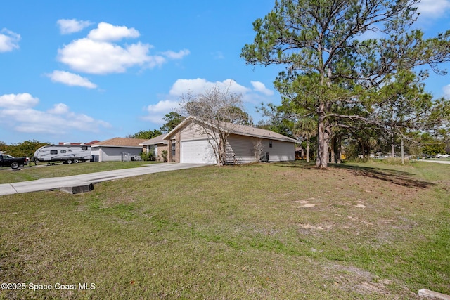 ranch-style house featuring driveway, a front lawn, and an attached garage