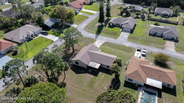 birds eye view of property with a residential view