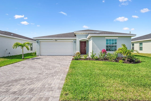 ranch-style home featuring a garage, a front lawn, decorative driveway, and stucco siding