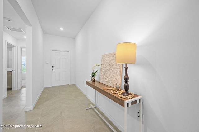 interior space featuring light tile patterned floors, baseboards, visible vents, and recessed lighting