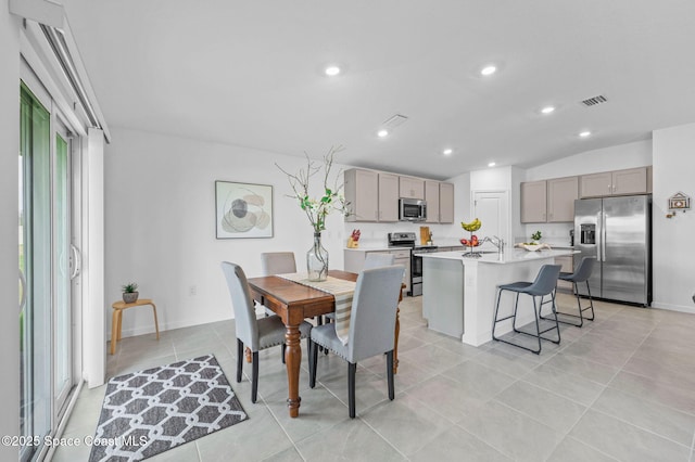 dining room featuring recessed lighting, visible vents, vaulted ceiling, and light tile patterned floors