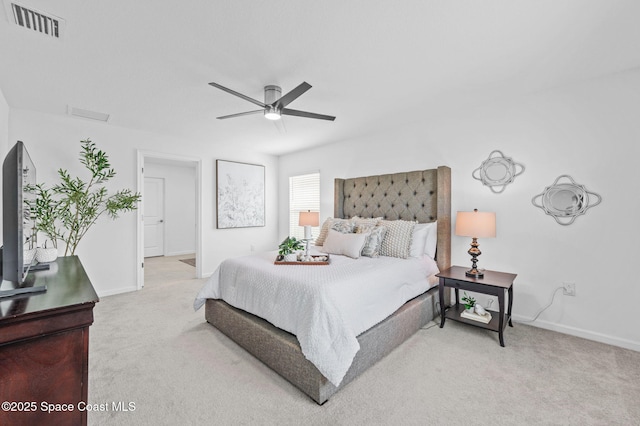 bedroom featuring light carpet, baseboards, and visible vents