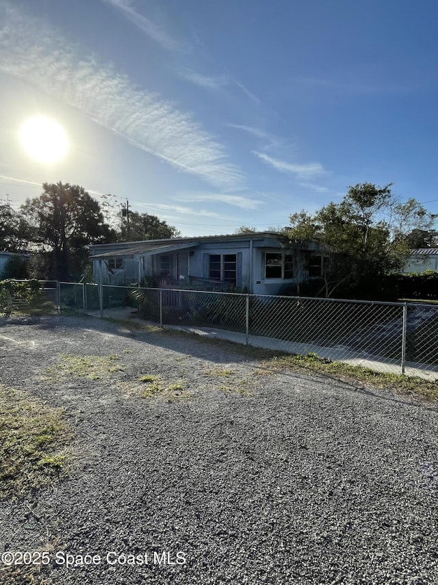 view of front facade featuring fence private yard