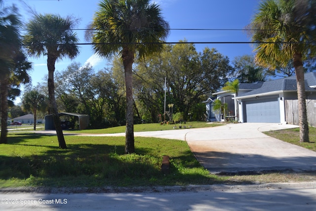 exterior space with concrete driveway and a garage