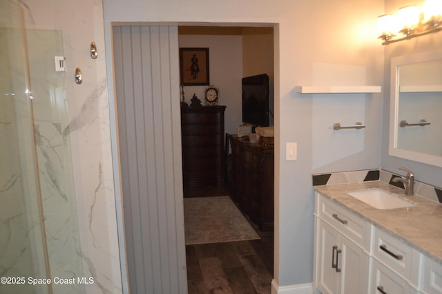 bathroom featuring wood finished floors and vanity