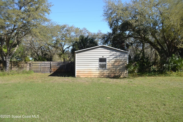 view of shed with fence