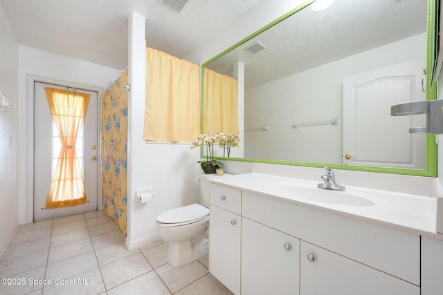 full bath featuring visible vents, toilet, vanity, a textured ceiling, and tile patterned floors