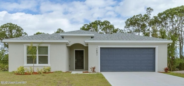 view of front of house with concrete driveway, stucco siding, roof with shingles, an attached garage, and a front yard