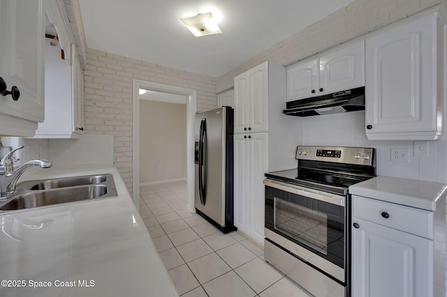 kitchen featuring stainless steel appliances, light countertops, under cabinet range hood, white cabinetry, and a sink