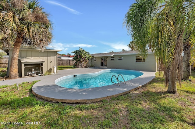 view of swimming pool featuring a patio, fence, and a fenced in pool