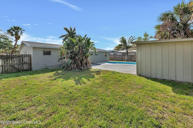 view of yard with a fenced in pool, a patio area, and a fenced backyard