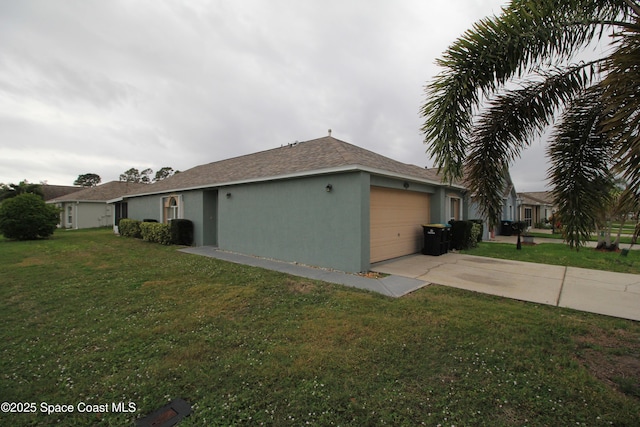 view of property exterior with a yard, an attached garage, driveway, and stucco siding