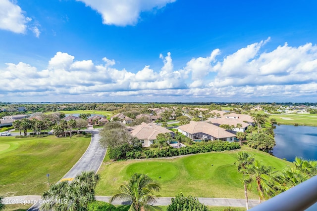 drone / aerial view with view of golf course, a water view, and a residential view