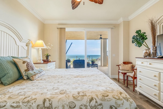 bedroom with access to outside, crown molding, baseboards, and wood finished floors