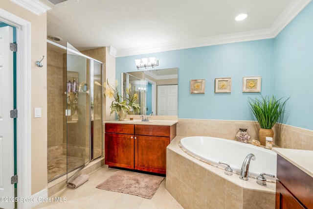 bathroom featuring a bath, ornamental molding, a stall shower, and vanity