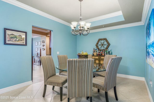 dining area with light tile patterned floors, baseboards, a chandelier, and crown molding