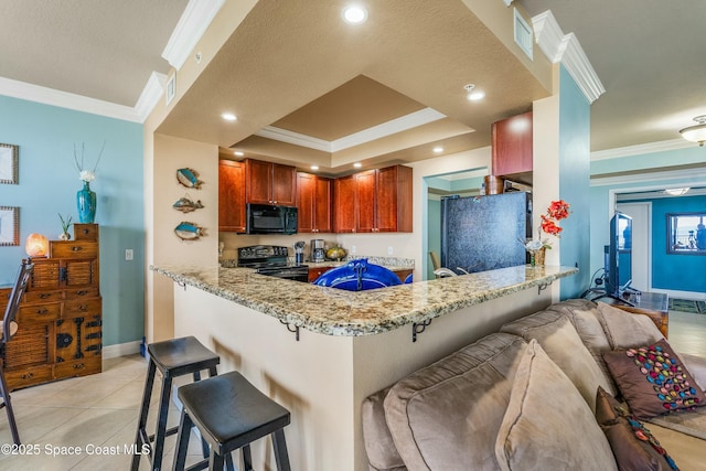 kitchen with black appliances, a peninsula, and crown molding