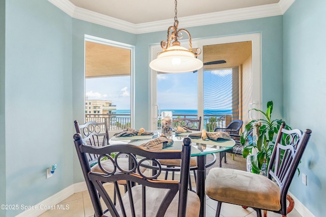 dining area featuring a water view, light tile patterned floors, baseboards, and ornamental molding