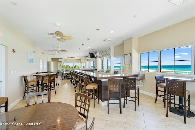 dining room with visible vents, baseboards, ceiling fan, light tile patterned flooring, and recessed lighting