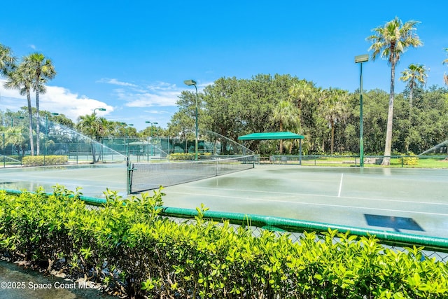 view of tennis court with fence