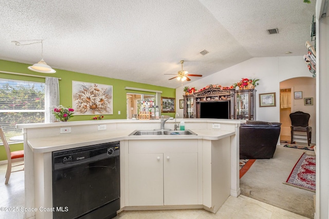 kitchen with pendant lighting, light countertops, open floor plan, white cabinetry, and dishwasher