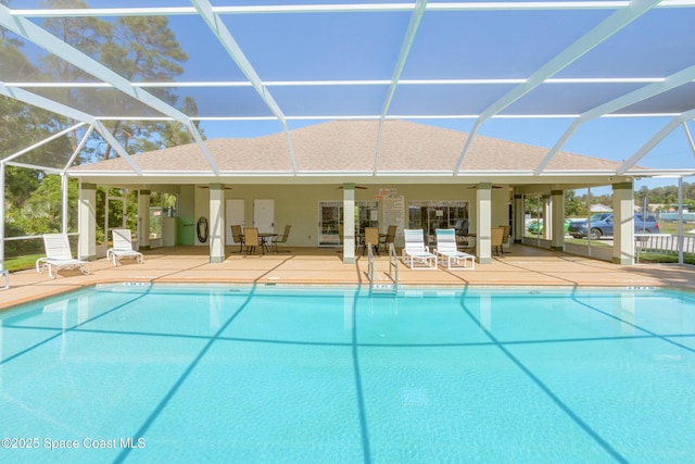 community pool featuring a lanai, a ceiling fan, and a patio