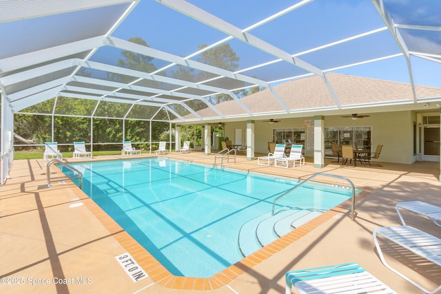 pool featuring a lanai, a patio, and ceiling fan