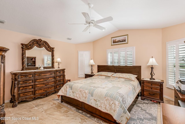 bedroom featuring lofted ceiling, visible vents, ceiling fan, and baseboards