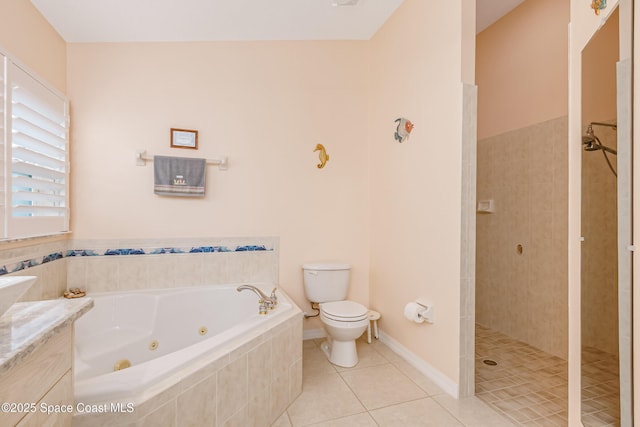 bathroom featuring toilet, a tile shower, vanity, a tub with jets, and tile patterned floors