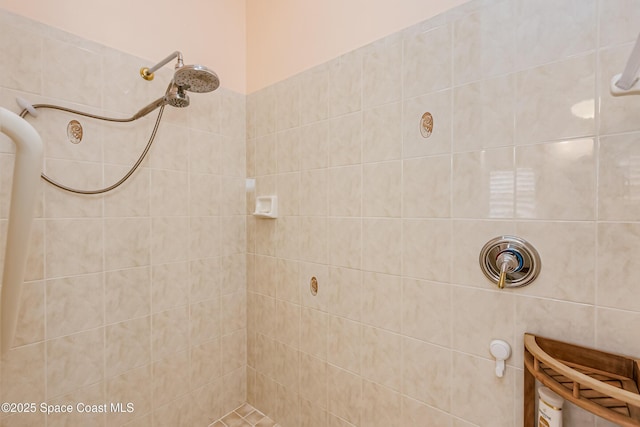 bathroom with tiled shower