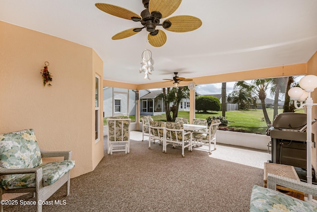 view of patio / terrace featuring outdoor dining space, a grill, and a ceiling fan