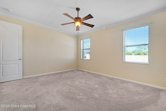 unfurnished room with light carpet, ceiling fan, a textured ceiling, and crown molding