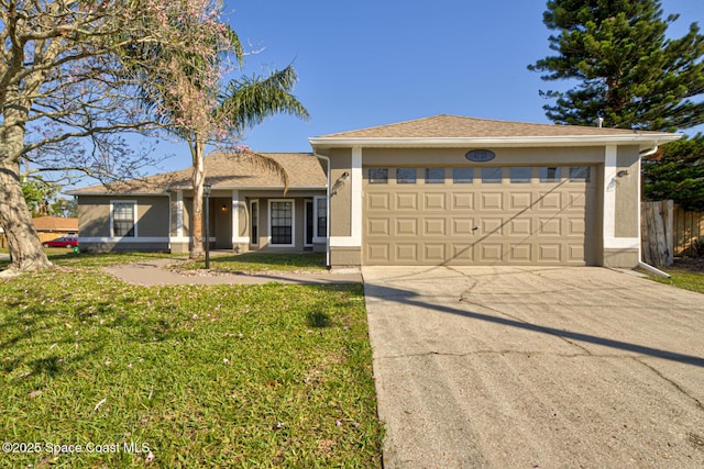 single story home with concrete driveway, an attached garage, fence, a front lawn, and stucco siding