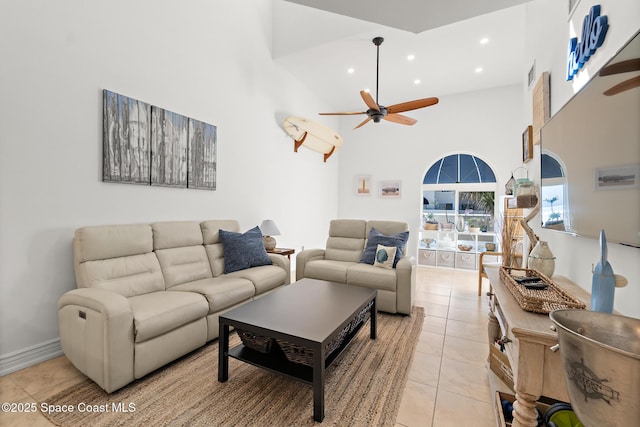 living area featuring light tile patterned floors, recessed lighting, visible vents, a towering ceiling, and ceiling fan