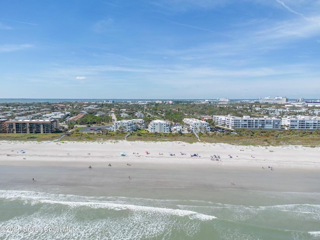 aerial view featuring a water view, a city view, and a view of the beach