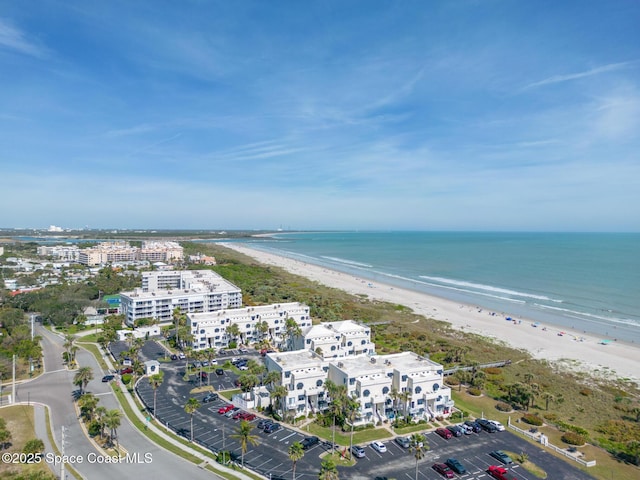 drone / aerial view featuring a view of the beach and a water view