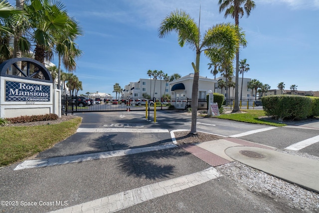 view of road featuring a gated entry and a gate