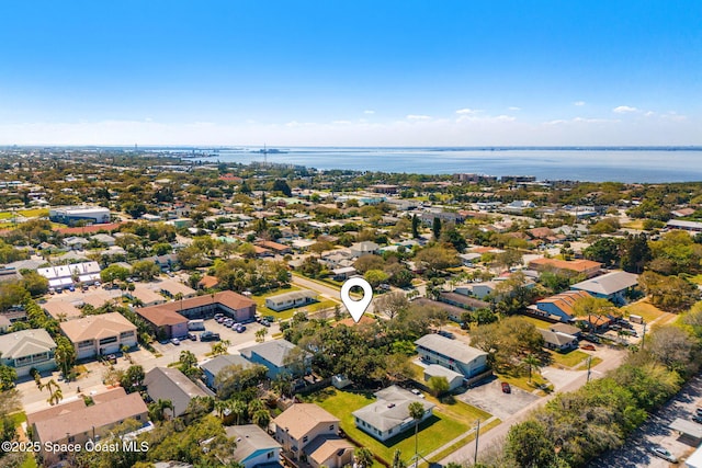 birds eye view of property with a water view and a residential view