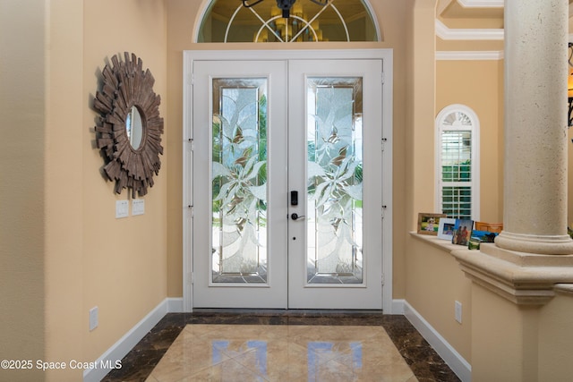 entryway featuring french doors, decorative columns, marble finish floor, and baseboards