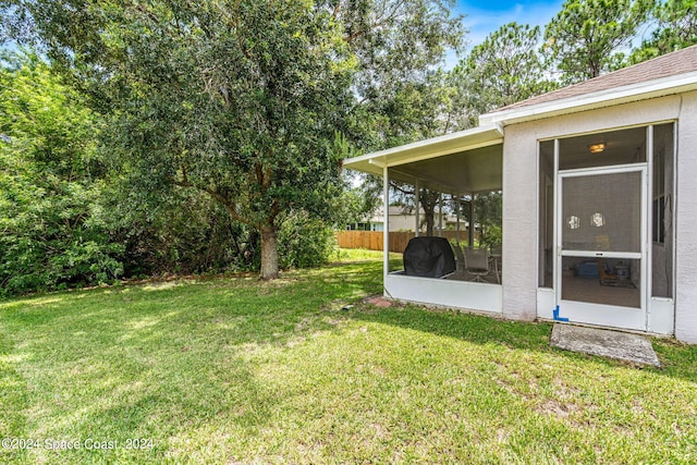 view of yard featuring a sunroom