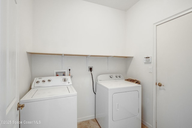 washroom featuring laundry area, light tile patterned floors, baseboards, and washer and dryer