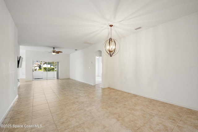 empty room with a ceiling fan, arched walkways, visible vents, and baseboards