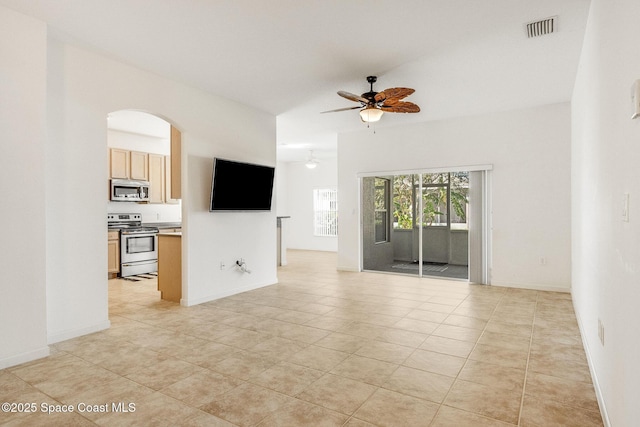 unfurnished living room featuring ceiling fan, visible vents, baseboards, and light tile patterned flooring