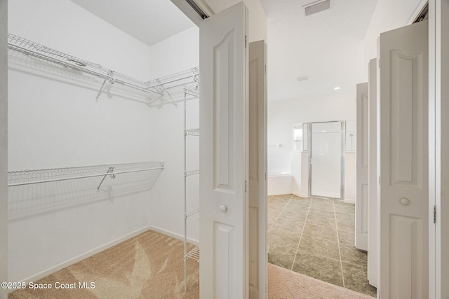 walk in closet with carpet and visible vents