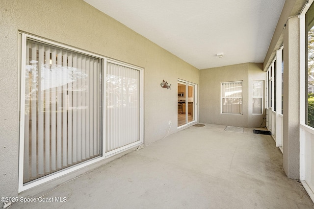 unfurnished sunroom featuring visible vents