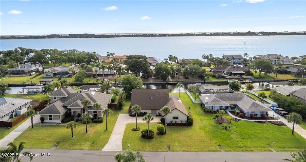birds eye view of property featuring a water view and a residential view