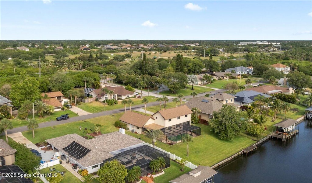 birds eye view of property featuring a water view and a residential view