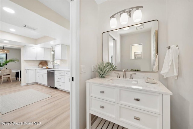 6315 Anchor Ln, Rockledge, FL 32955 - bathroom featuring vanity, wood finished floors, and recessed lighting
